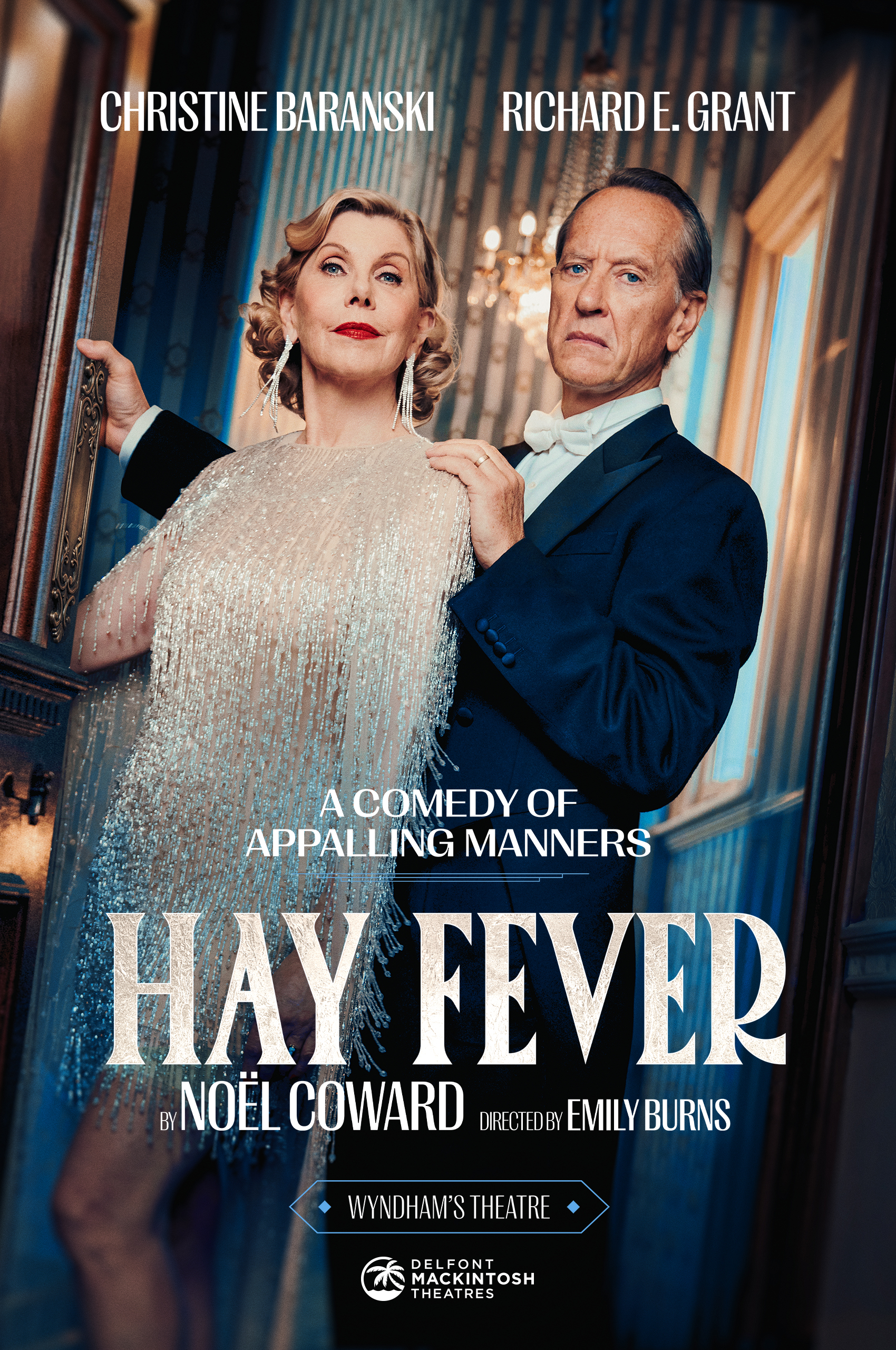 A promotional poster for Hay Fever play at Wyndham's Theatre. Christine Baranski stands dressed in a jewelled tassel dressed and Richard E. Grant stands behind her dressed in a suit and white bow tie