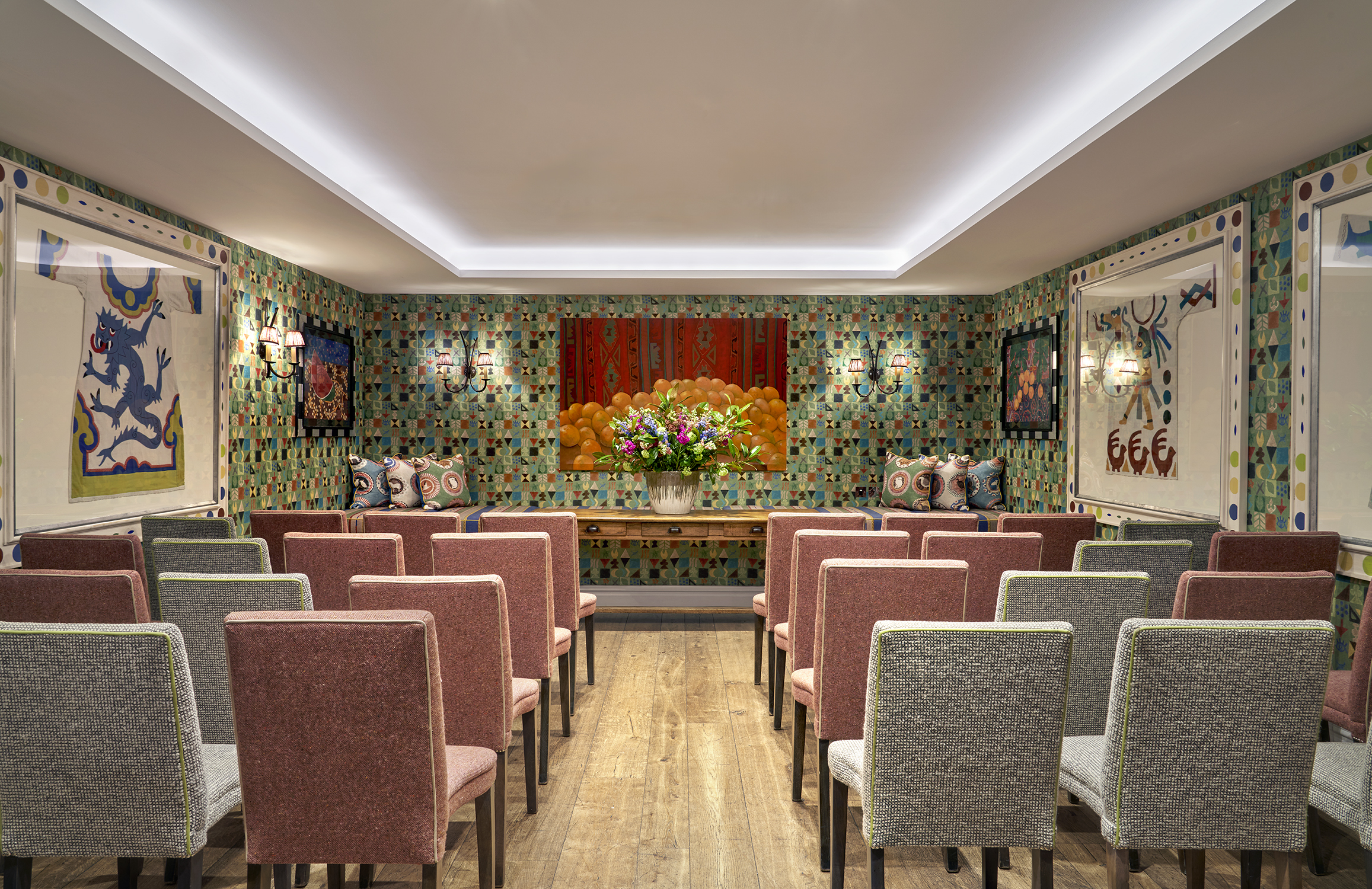 A back shot of a wedding style set-up in the Vanessa Bell private events room at Charlotte Street Hotel