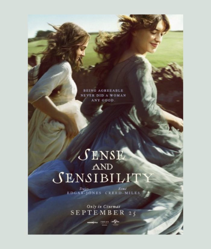 A promotional poster for the 2026 'Sense and Sensibility' film. Two young women wearing period dresses run across a field. White text is printed over the top of them. The poster is surrounded by a light blue border