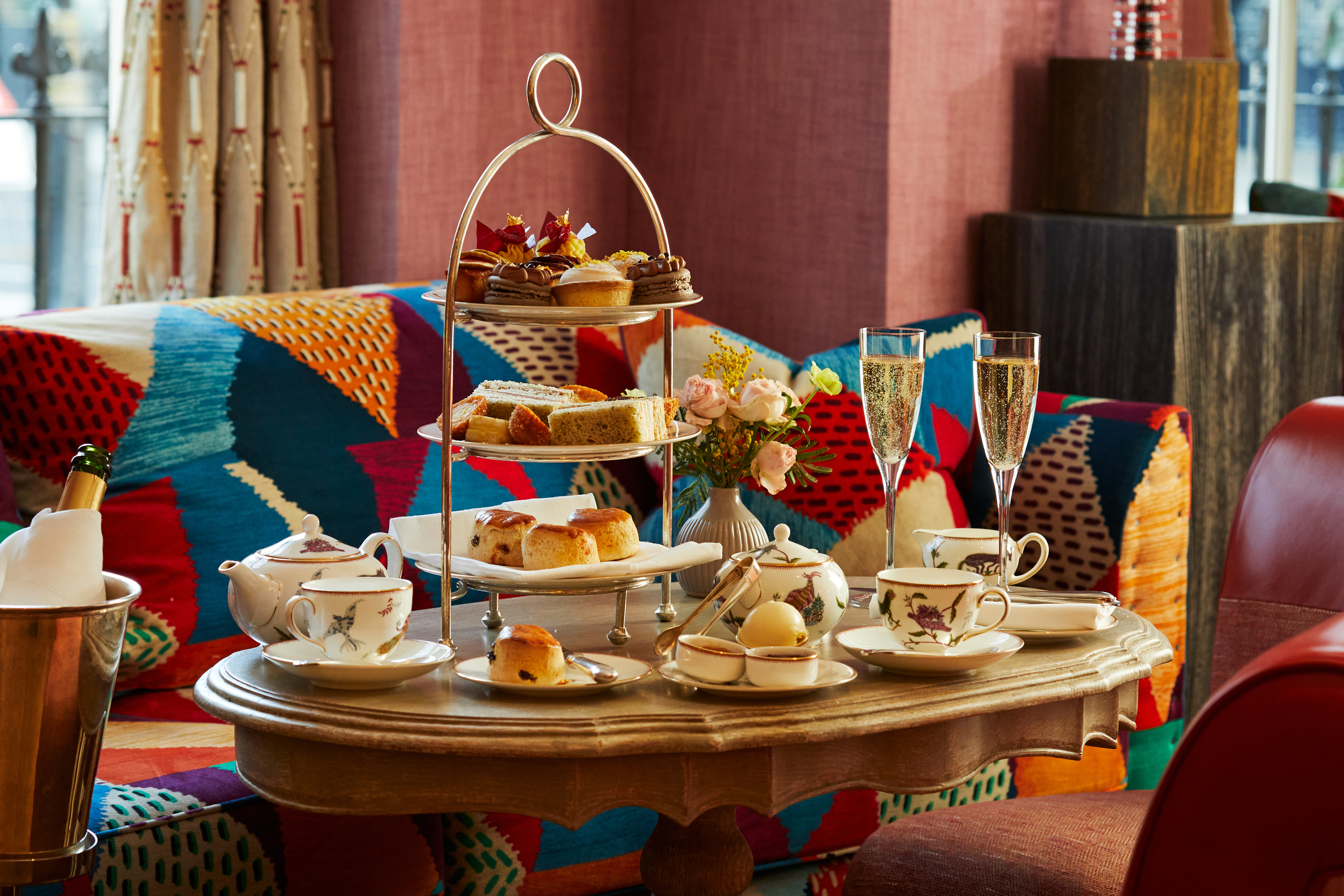 An afternoon tea with mythical creatures tea set on a table at Brummus at Haymarket Hotel