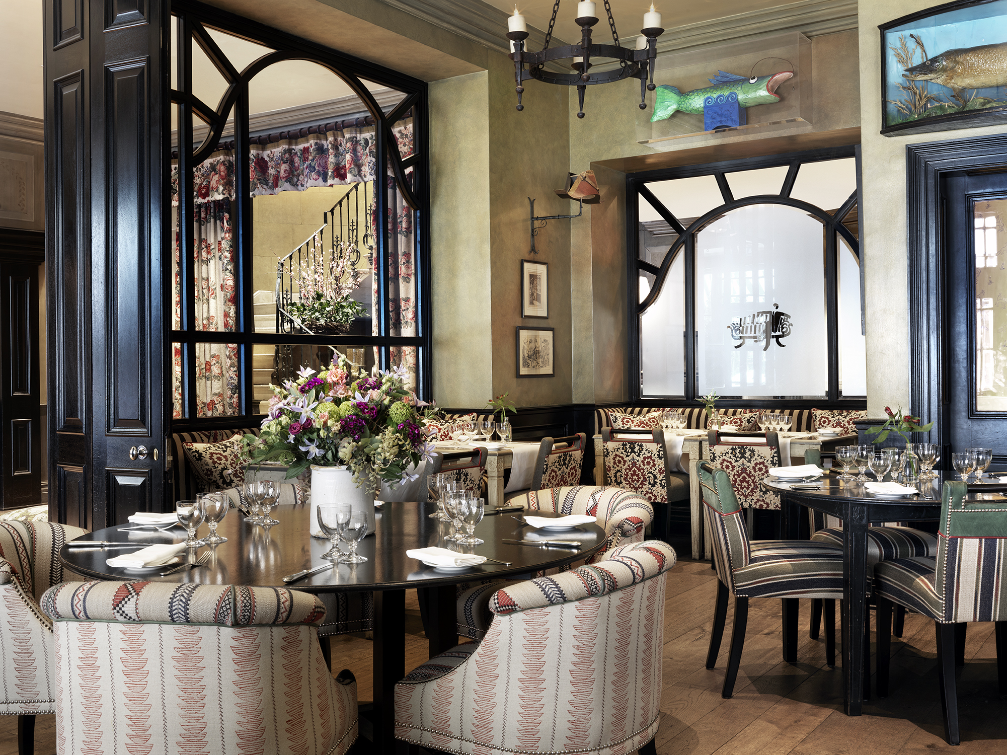Diagonal shot of Brasserie Max set up for dinner at Covent Garden Hotel.