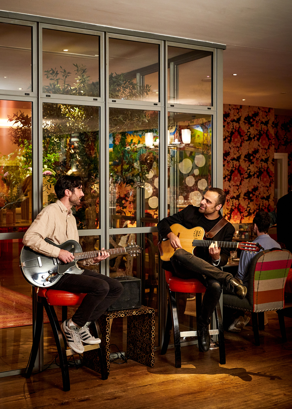 Two guitarists playing at Refuel