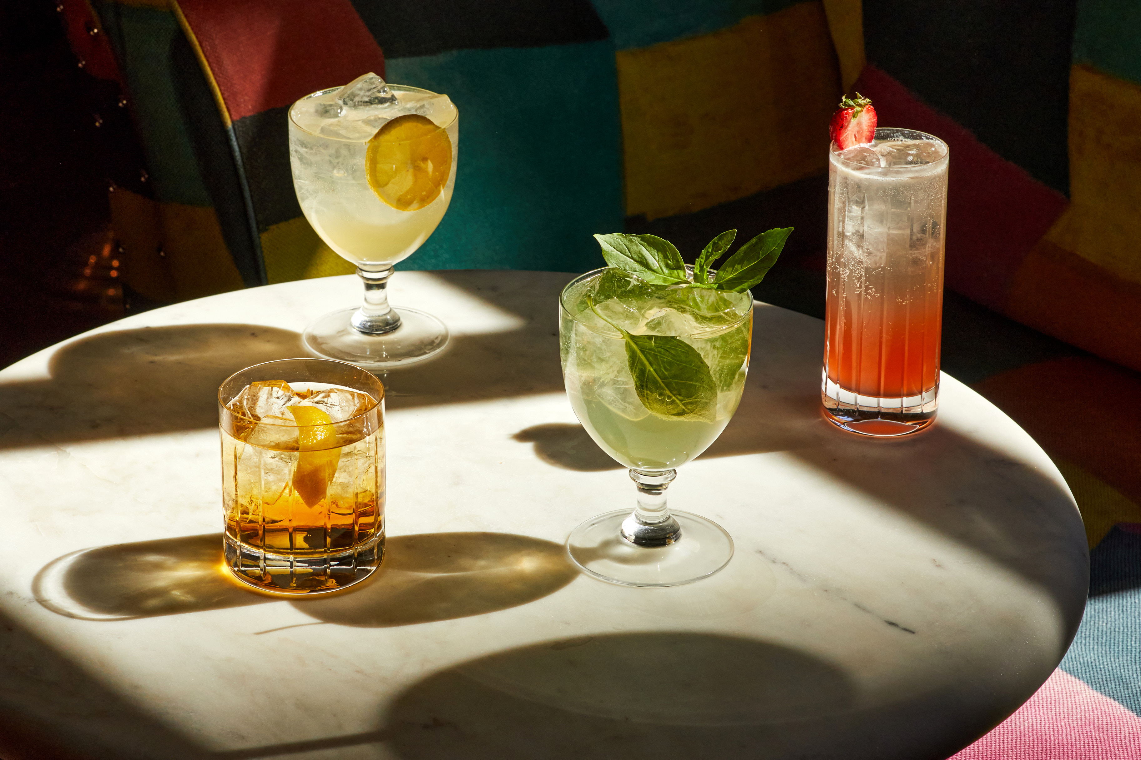 A shot of multiple cocktails on a table at Warren Street Hotel.