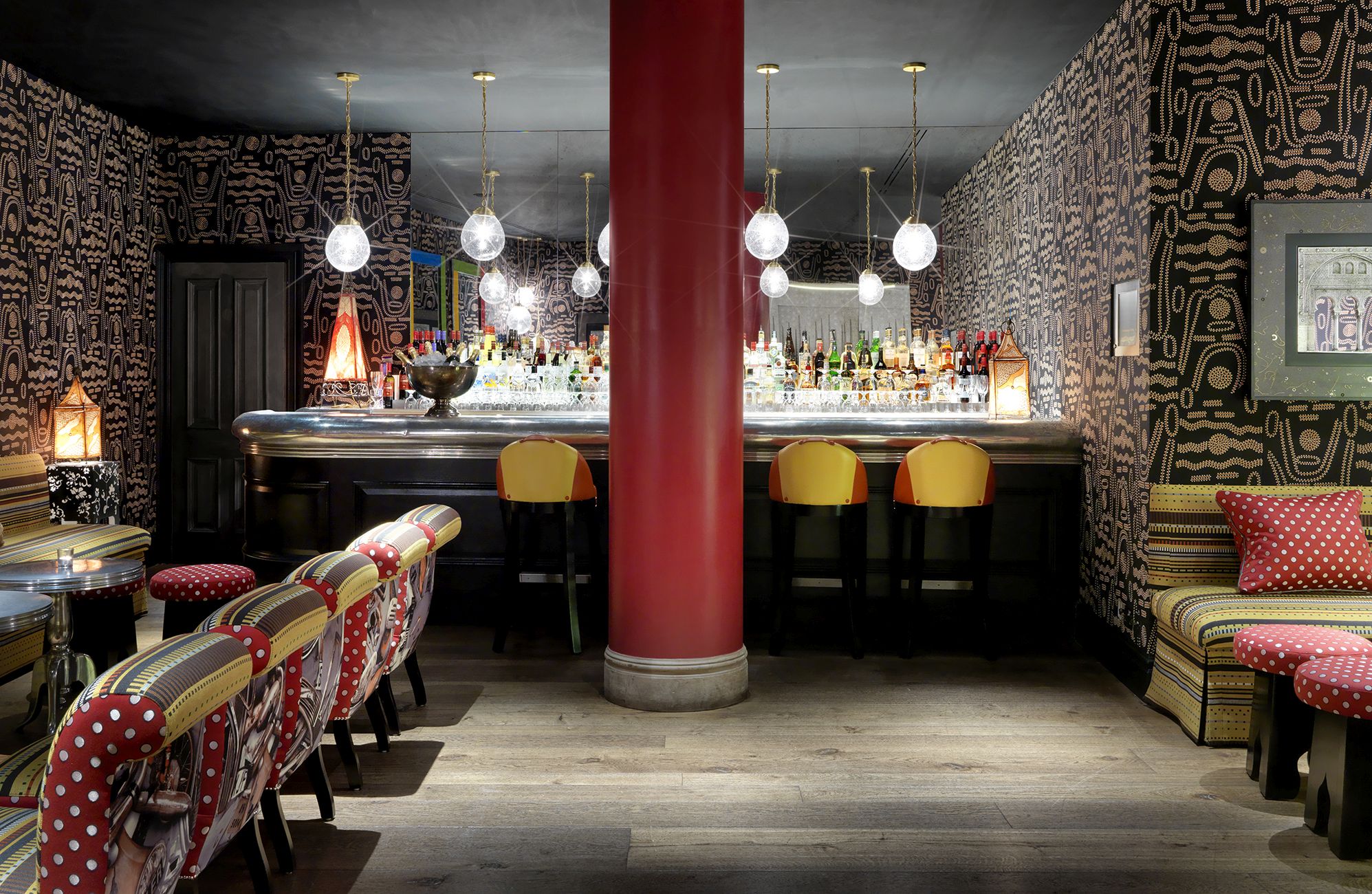 Wide shot of the bar in the Crimson Bar private events room at the Soho Hotel