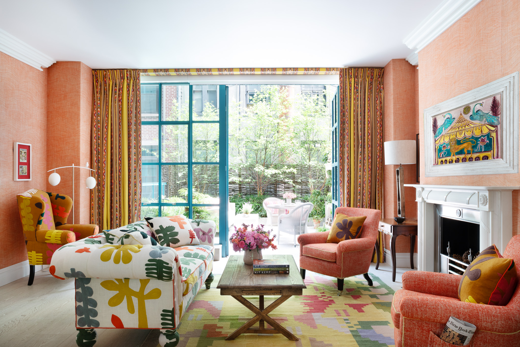 A wide shot of the sitting area opening onto the terrace in The Garden Suite at Warren Street Hotel