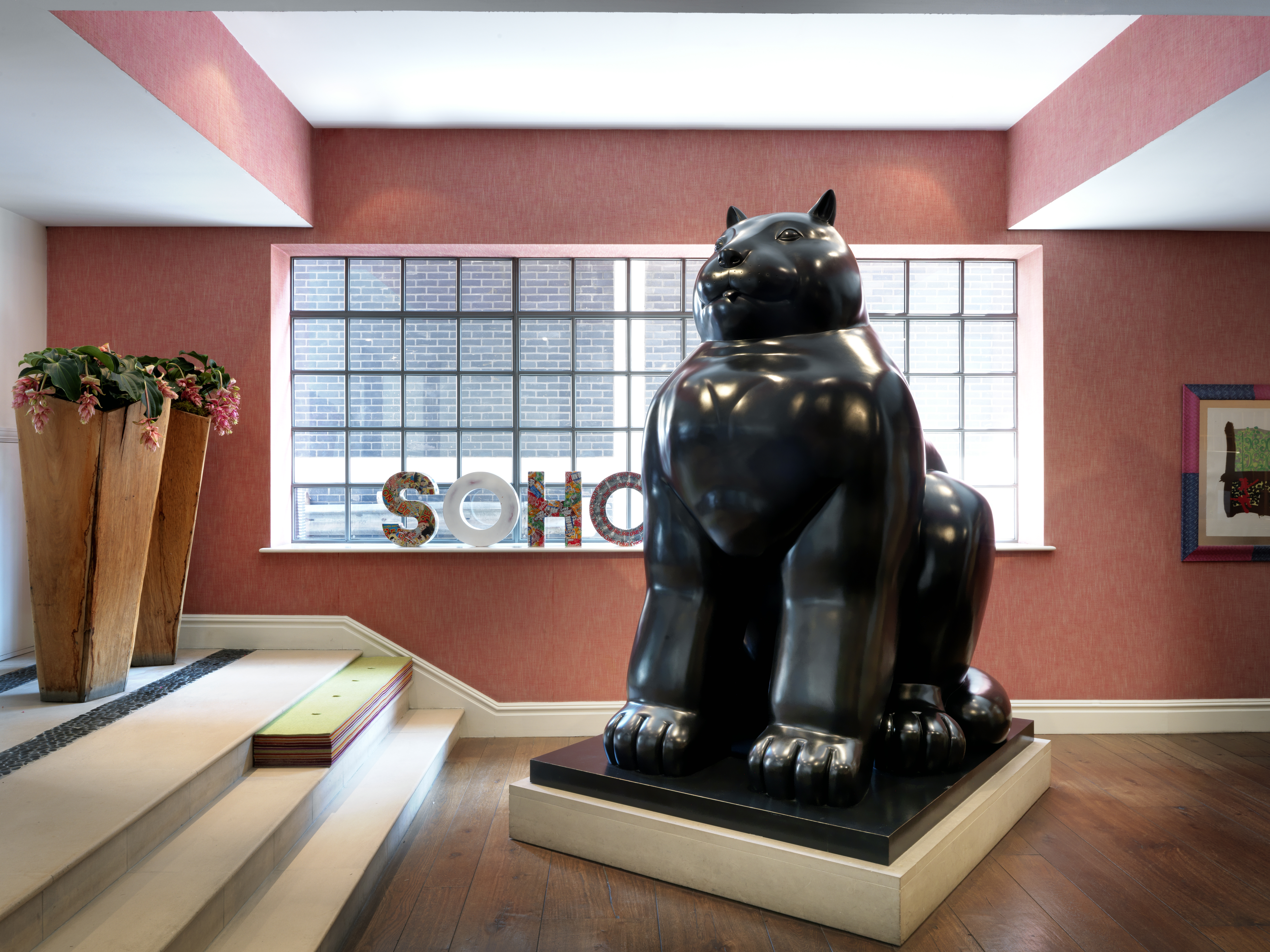 Close shot of the Botero Cat Sculpture in the lobby at The Soho Hotel