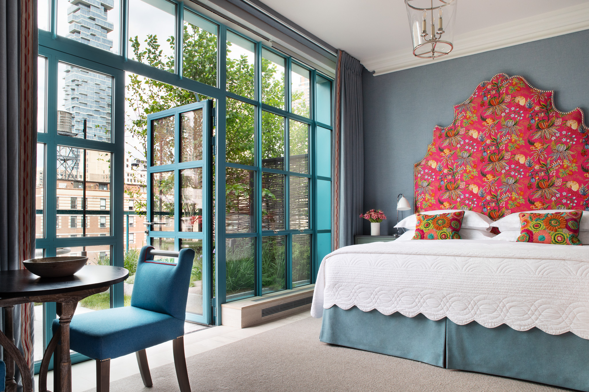 Diagonal shot of Junior Terrace Suite, 906 looking out onto the terrace at Warren Street Hotel