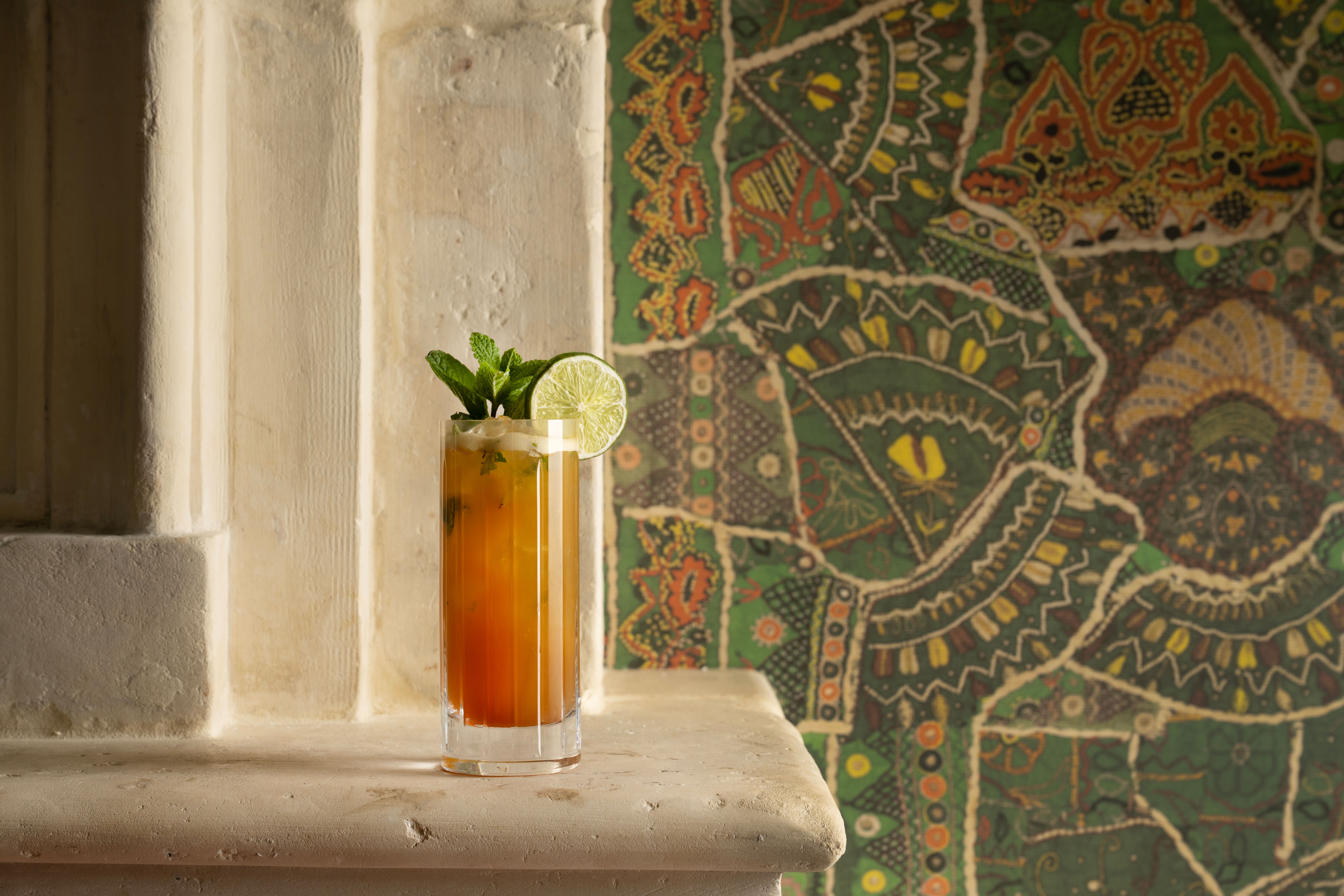 A wide angle close-up shot of one of the cocktails served in a highball glass at The Crosby Bar