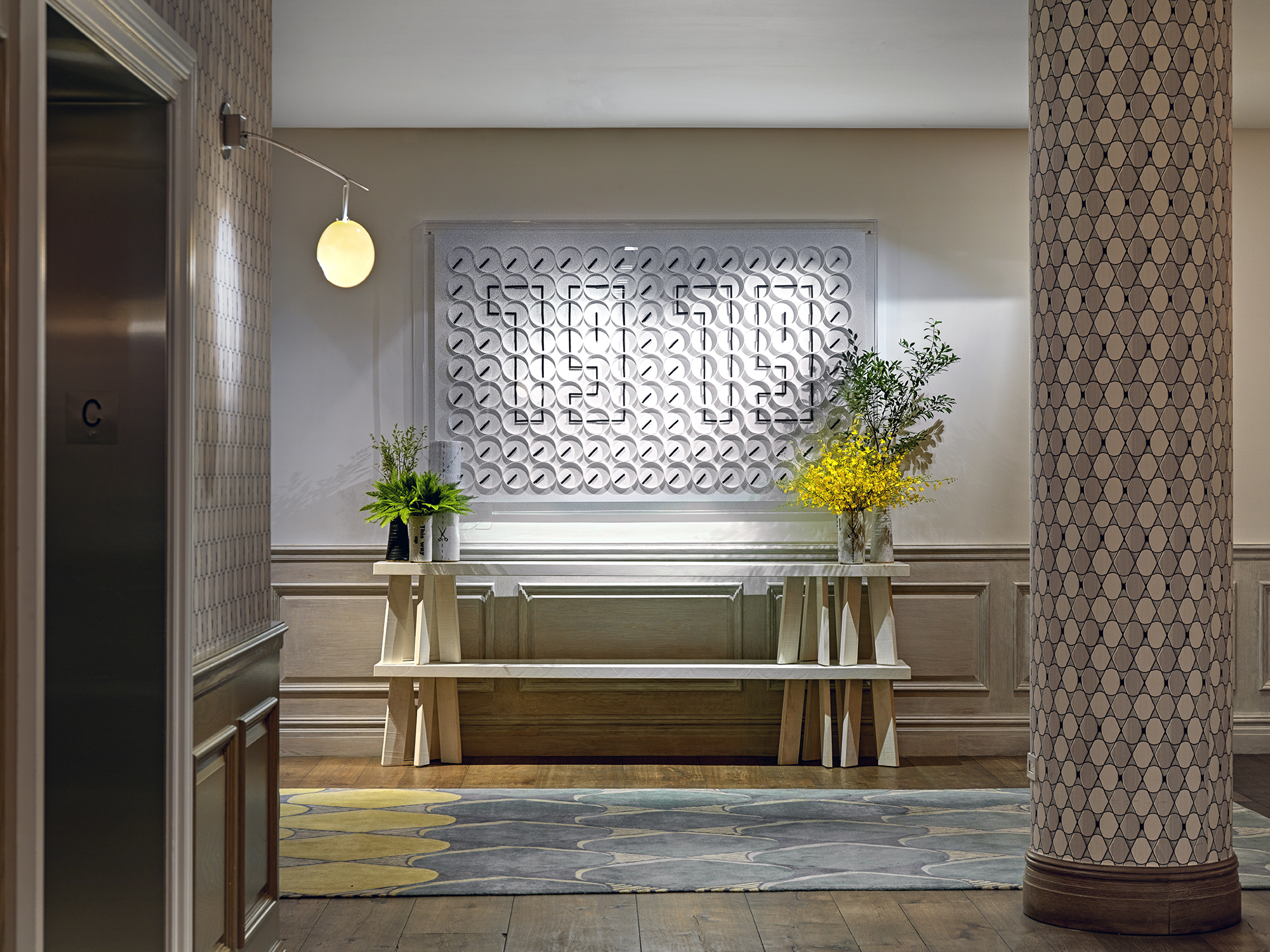 Close shot of the clock artwork in the private events lobby at Crosby Street Hotel