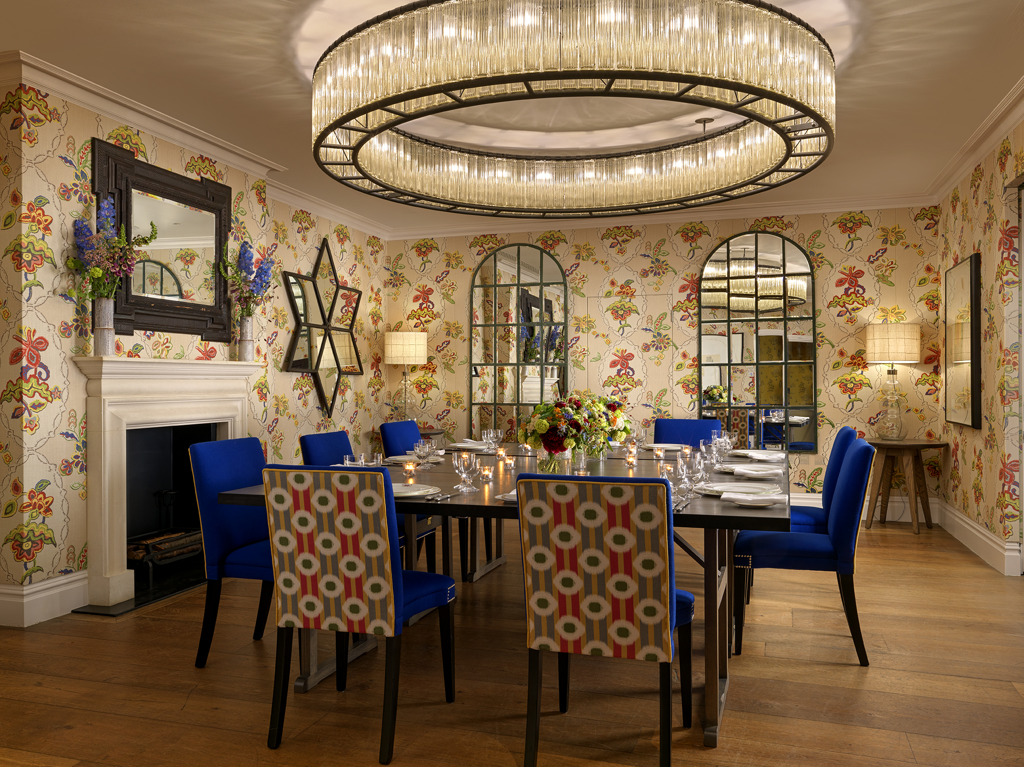 Squared dining table set-up with dim lighting in the Fortune private events room at Covent Garden Hotel