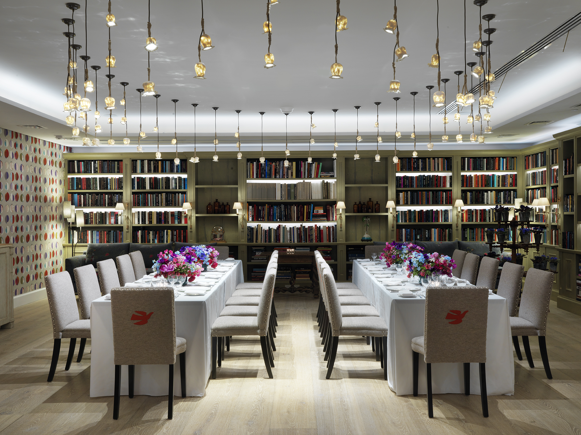 Long dining tables set-up in the Reading private events room at the Whitby Hotel