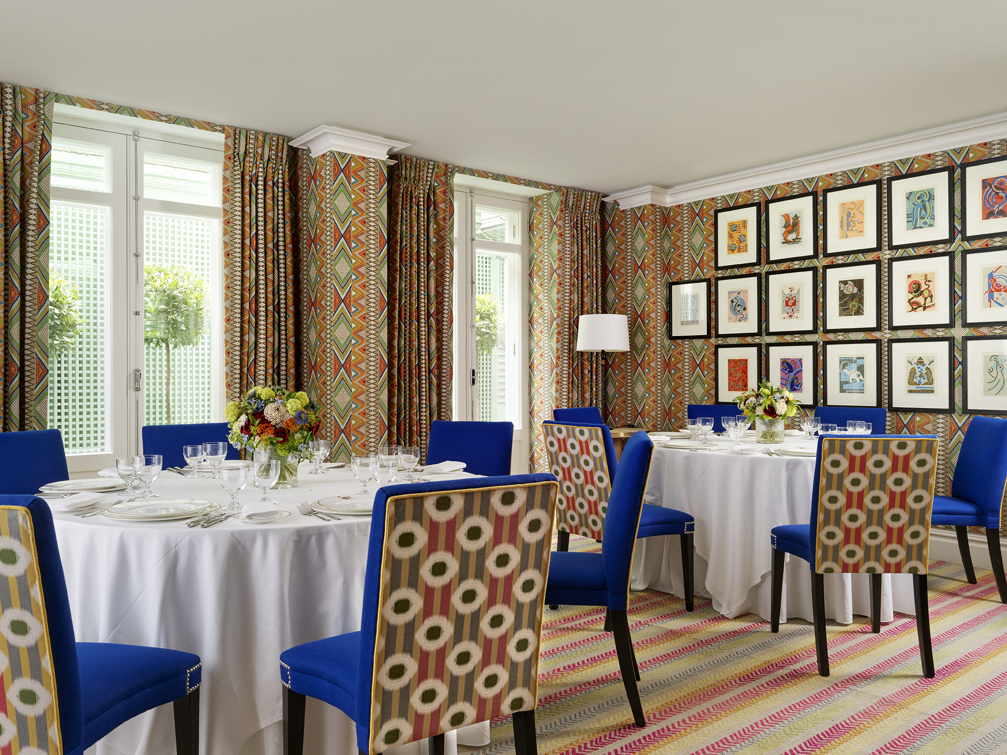Round dining tables set-up in the Lyric private events room at Covent Garden Hotel