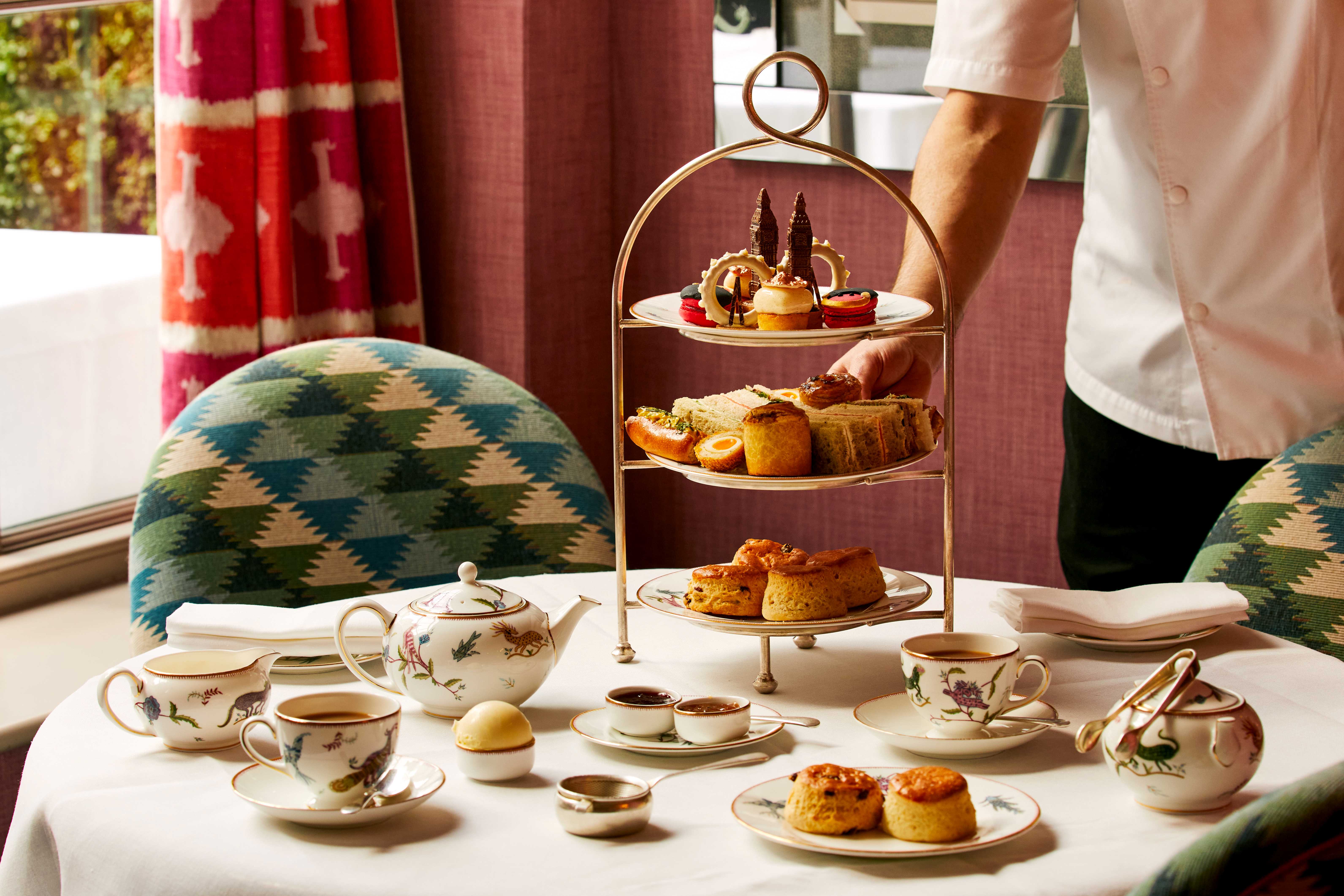 An afternoon tea set up at Brumus in Haymarket Hotel. The cakes are designed to reflect iconic London landmarks