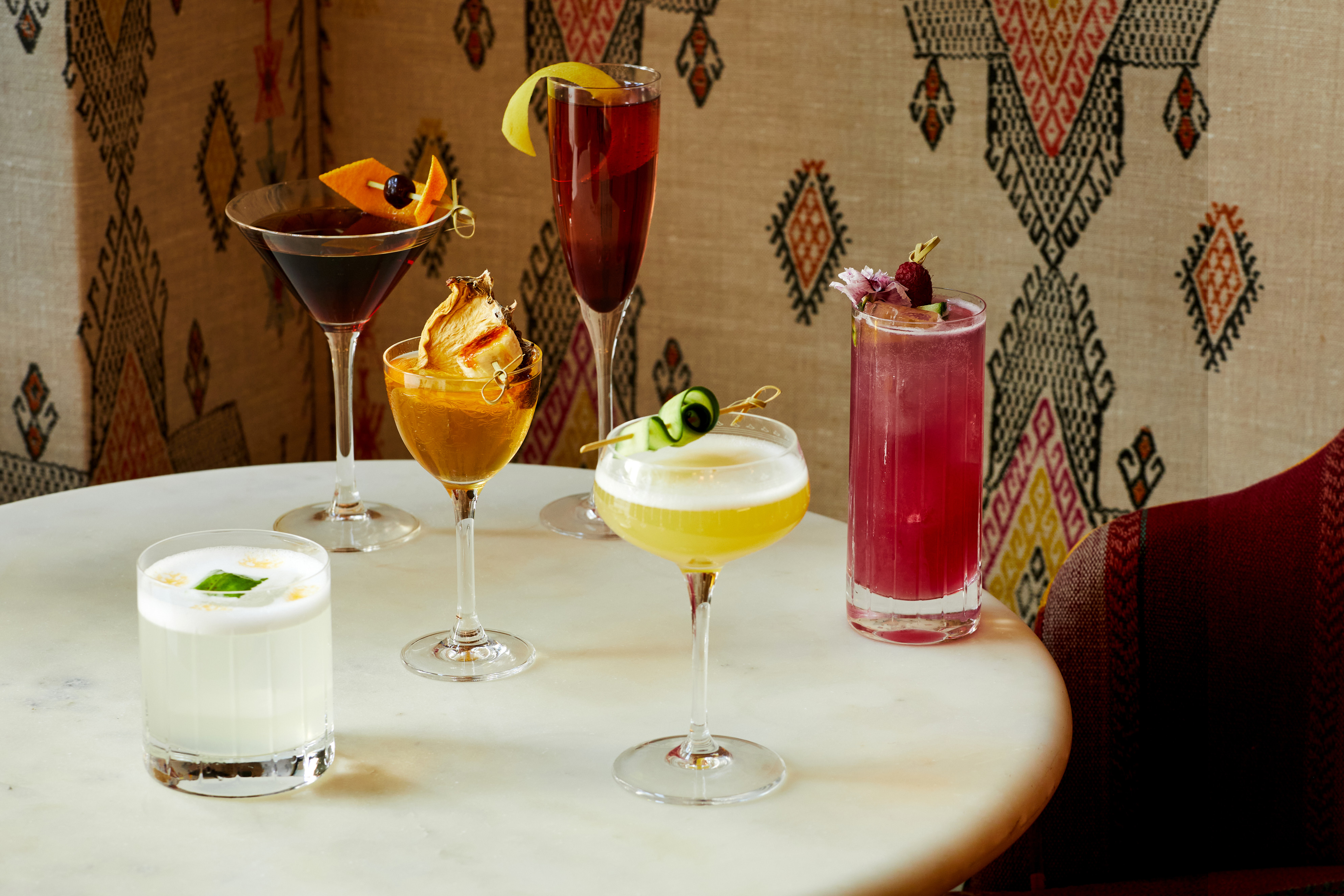 Landscape shot of multiple cocktails at The Whitby Bar in The Whitby Hotel.