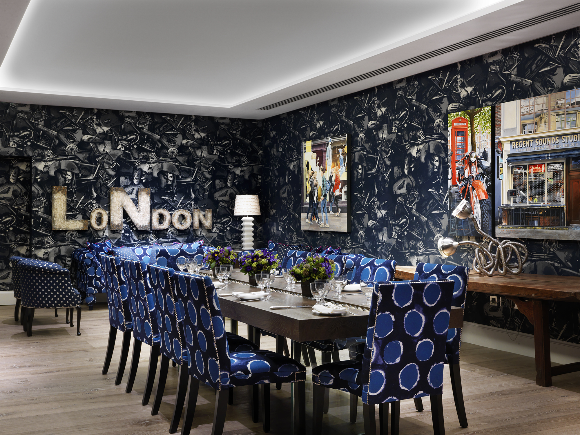 Wide rom shot of a long dining table set-up in the Archer private events room at Ham Yard Hotel