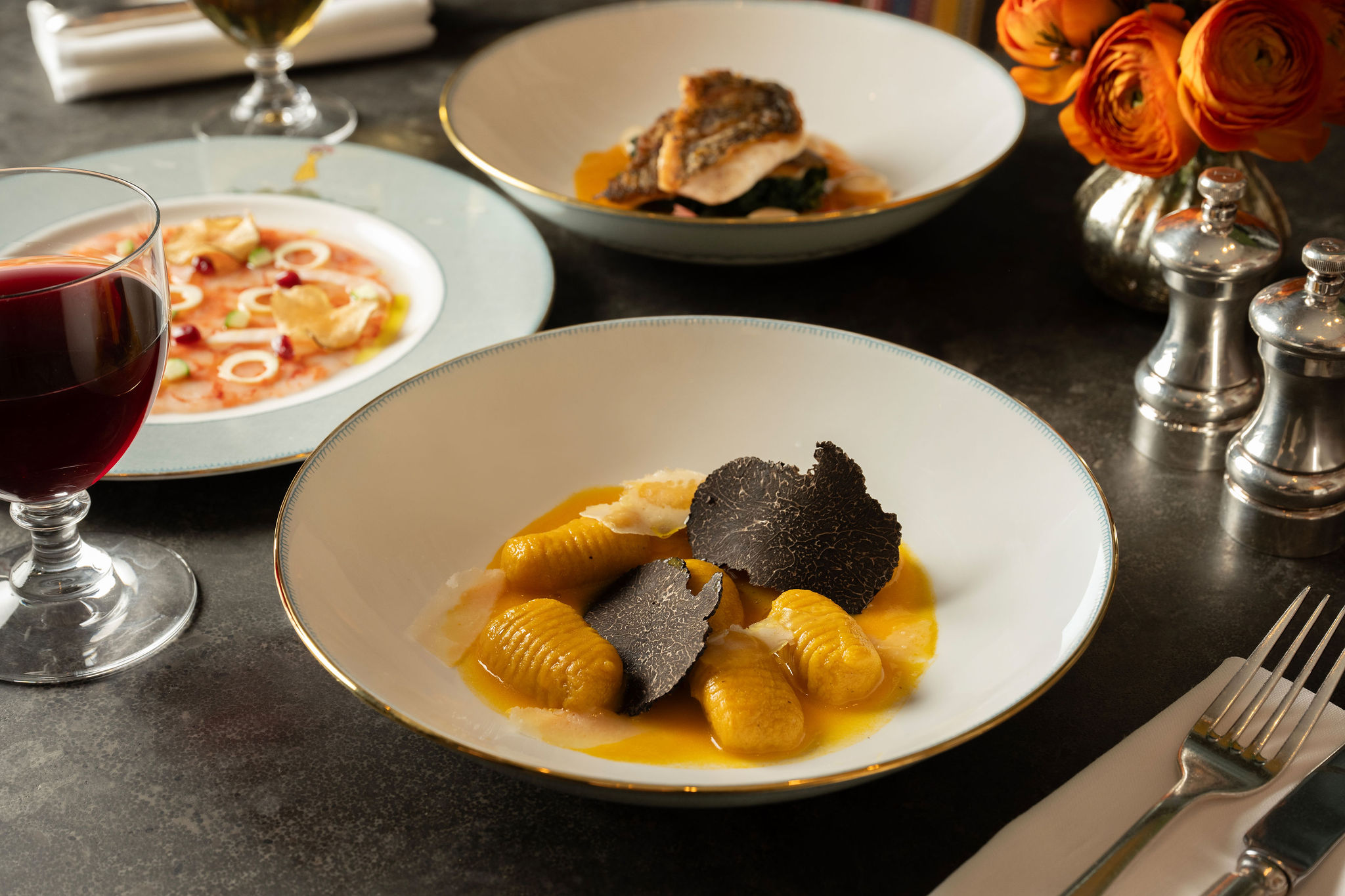 A close up image of the Fall squash gnocchi dish at The Whitby Bar, The Whitby Hotel on Mythical creatures crockery.