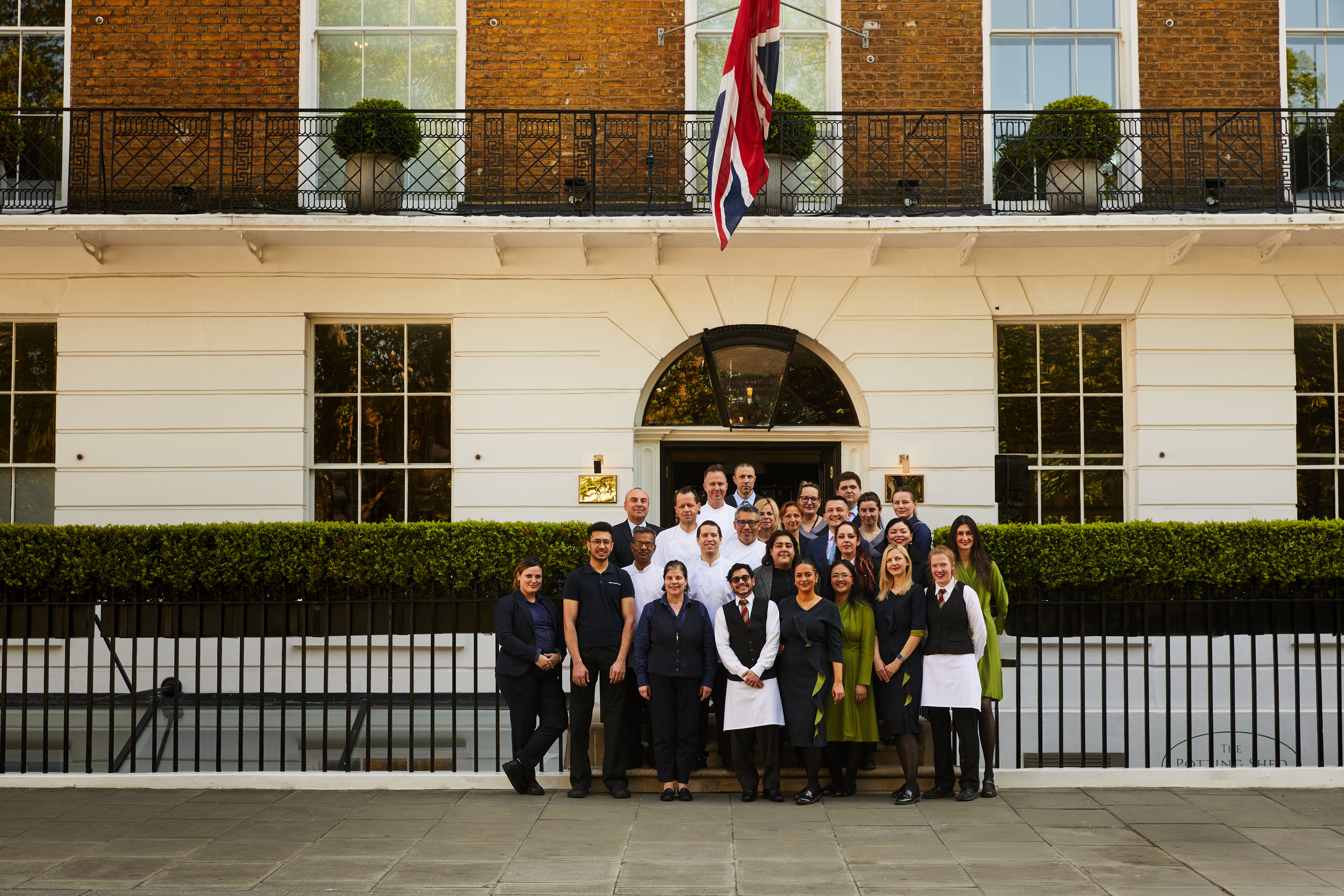 The team at Dorset Square Hotel stand outside the front of the building