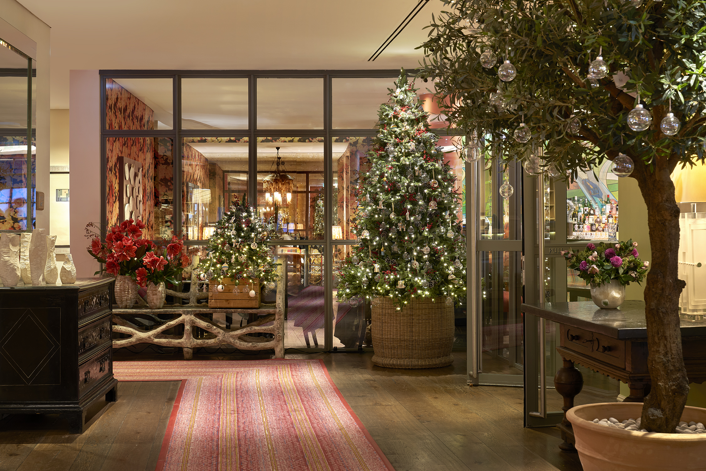 Wide shot of the Christmas tree and decorations in the lobby at The Soho Hotel