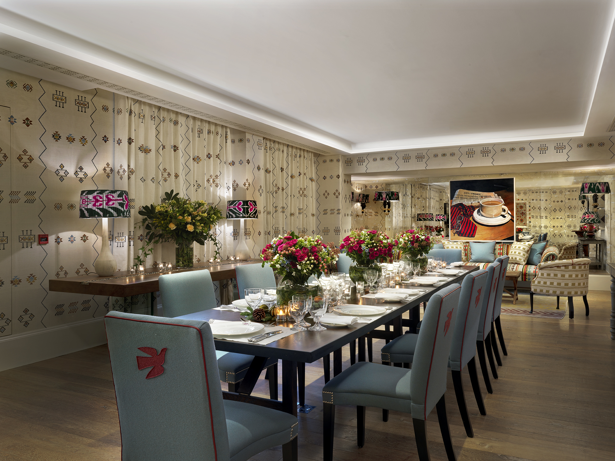 Night shot of a long dining table in the Rocklin private events room at Haymarket Hotel