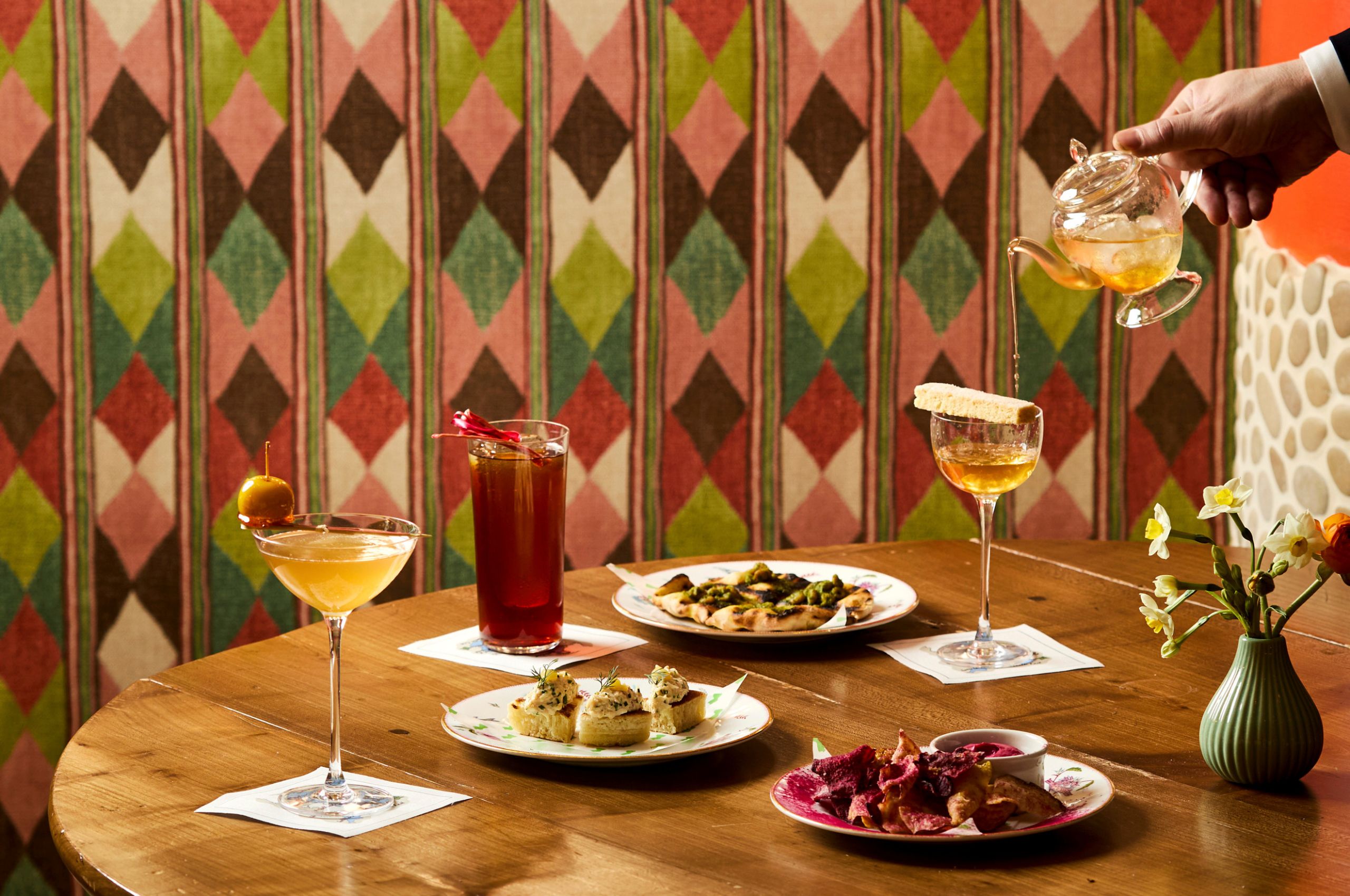 Wide image of cocktails and appetisers at Refuel