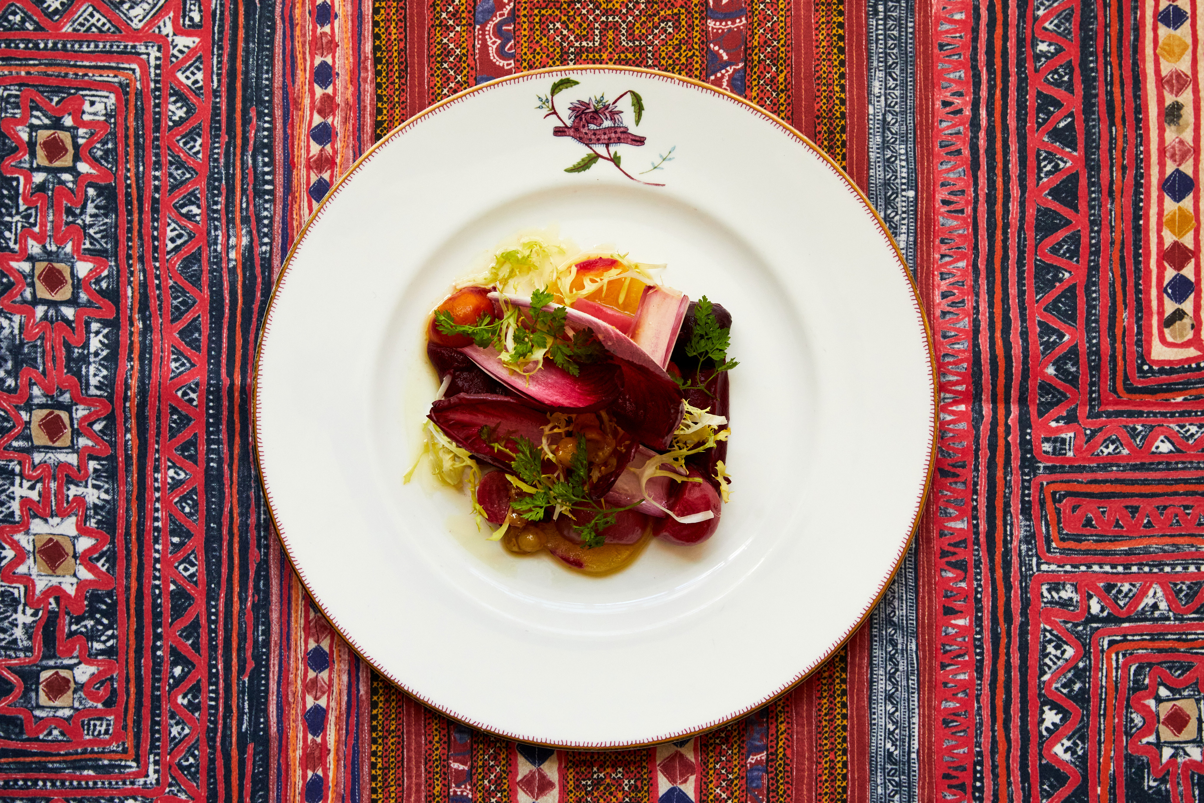 An image of a salad dish on a plate, from the A La Carte Menu at Refuel, Soho Hotel.