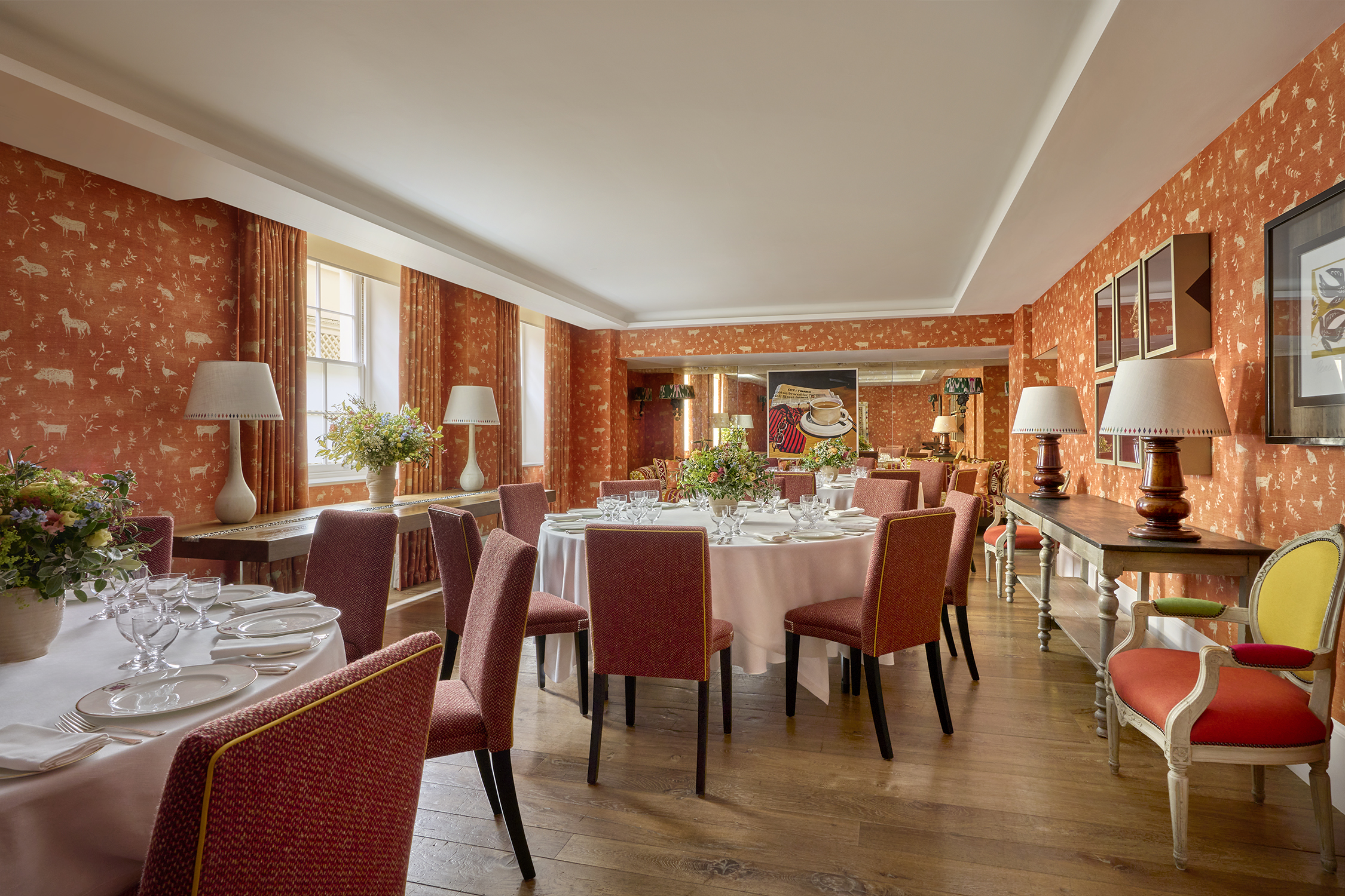 Day shot of a three round tables set up for private dining in the Rocklin Room at Haymarket Hotel