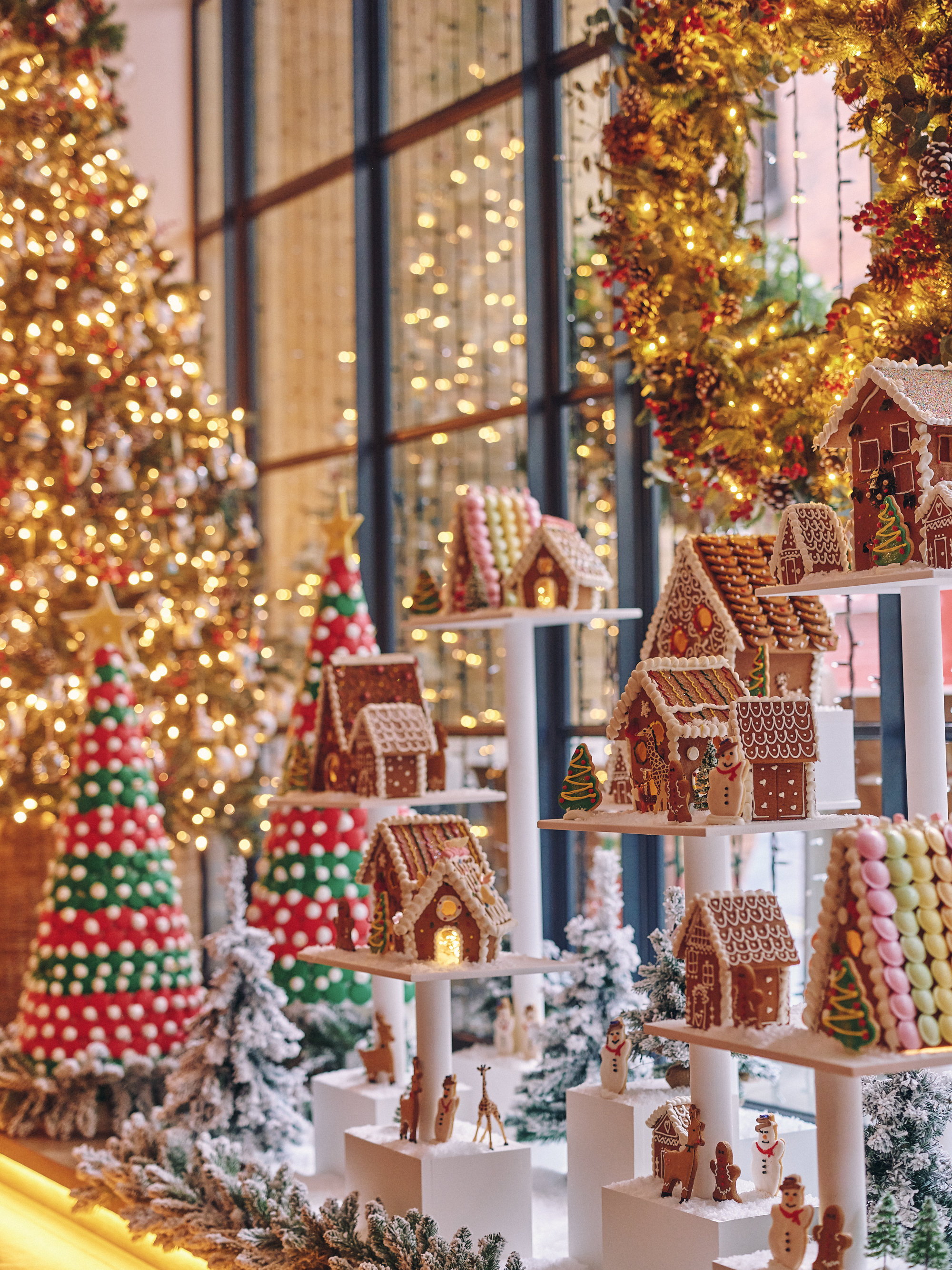 A portrait close up image of the multi teared gingerbread village at Ham Yard Hotel.