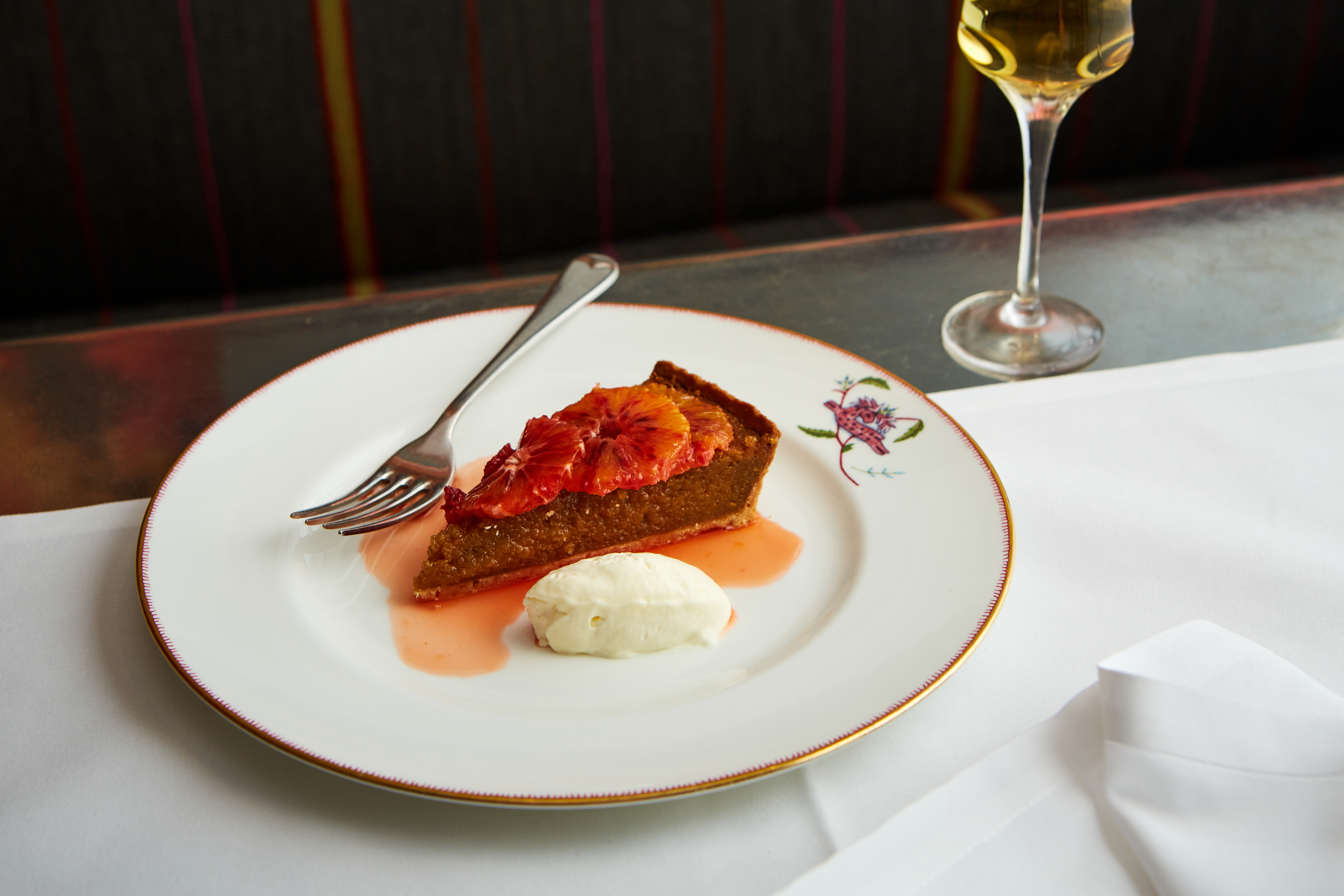 Close up shot of a treacle tart with ice cream at Refuel