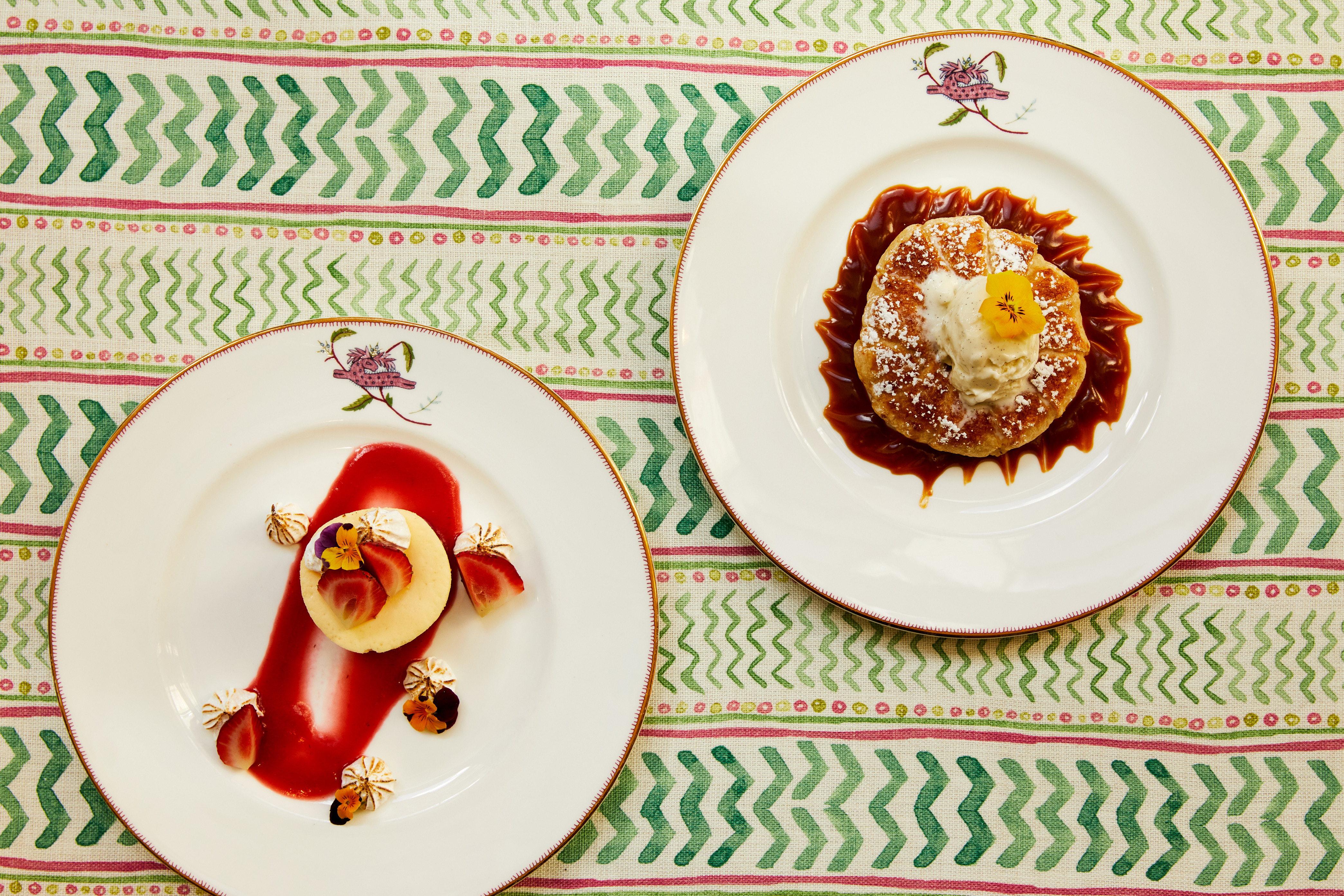 Close up shot of a cheesecake and the tart on a plate from the desserts menu, at Crosby Street Hotel.