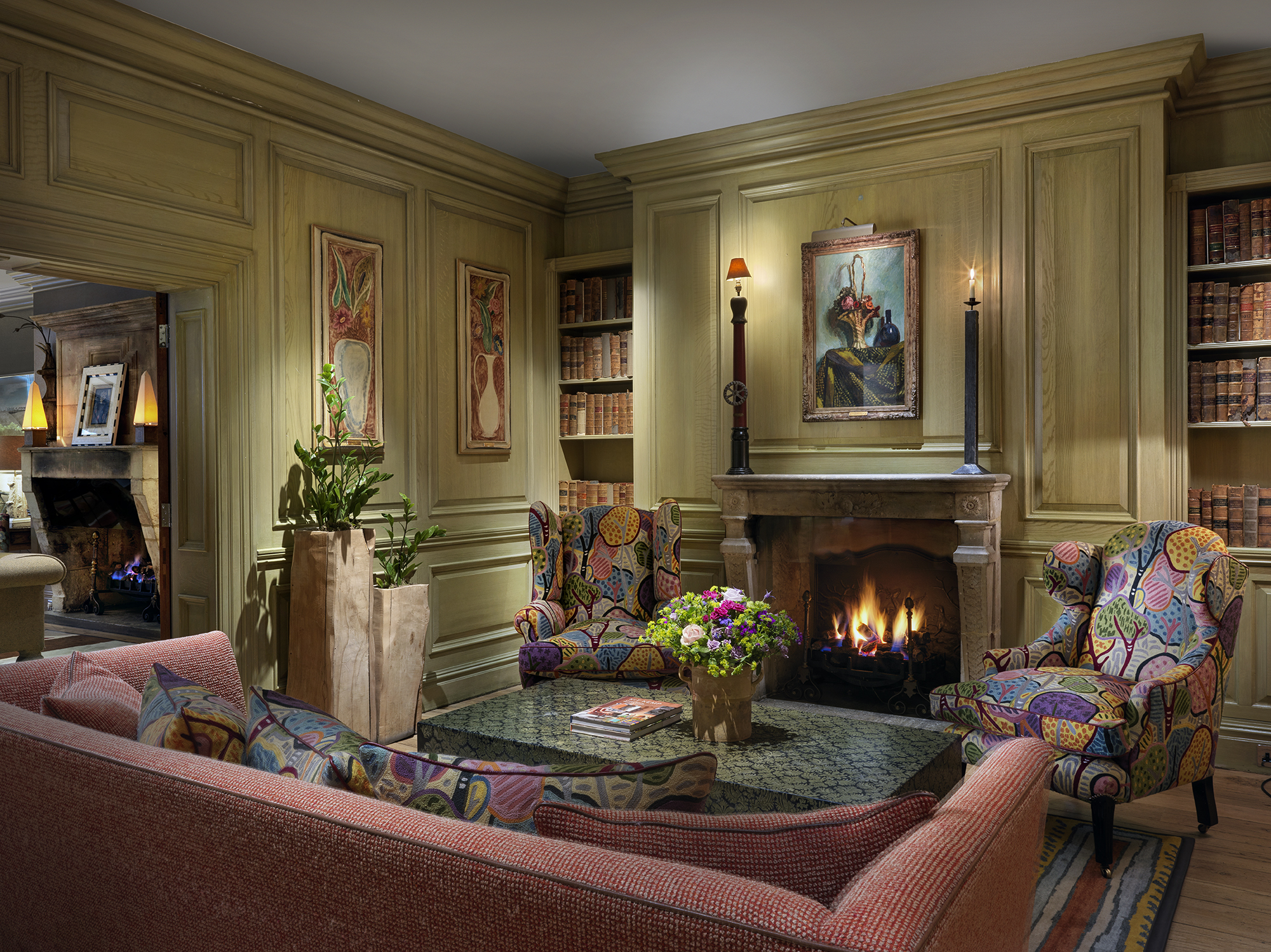 Wide shot of the fireplace in the Library at Charlotte Street Hotel
