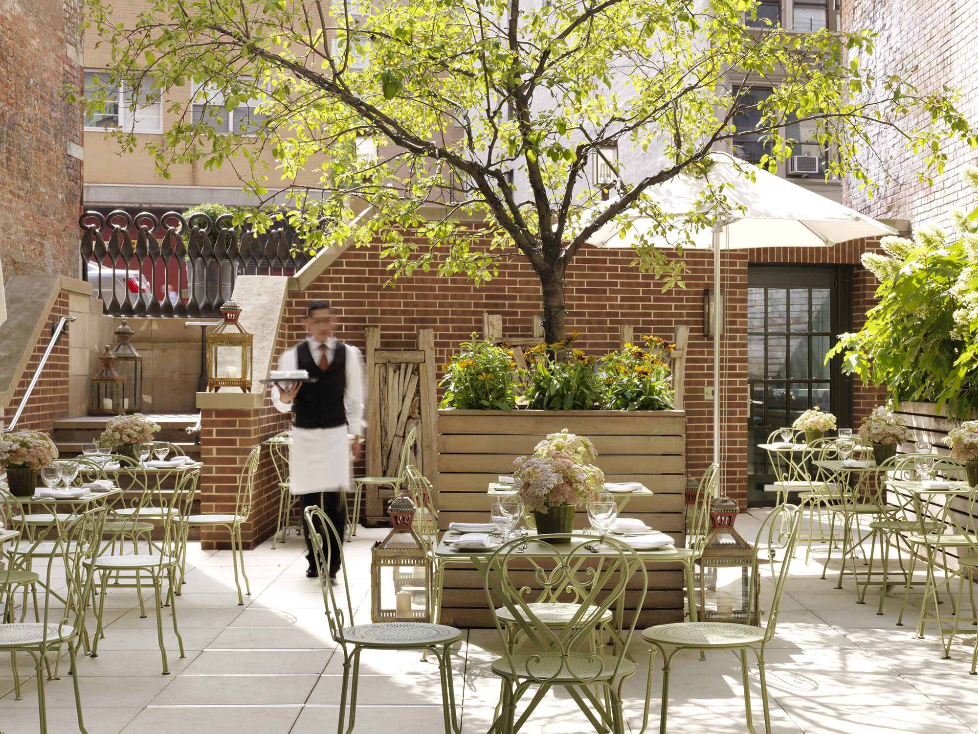 Front shot of tables in the Terrace at Crosby Street Hotel
